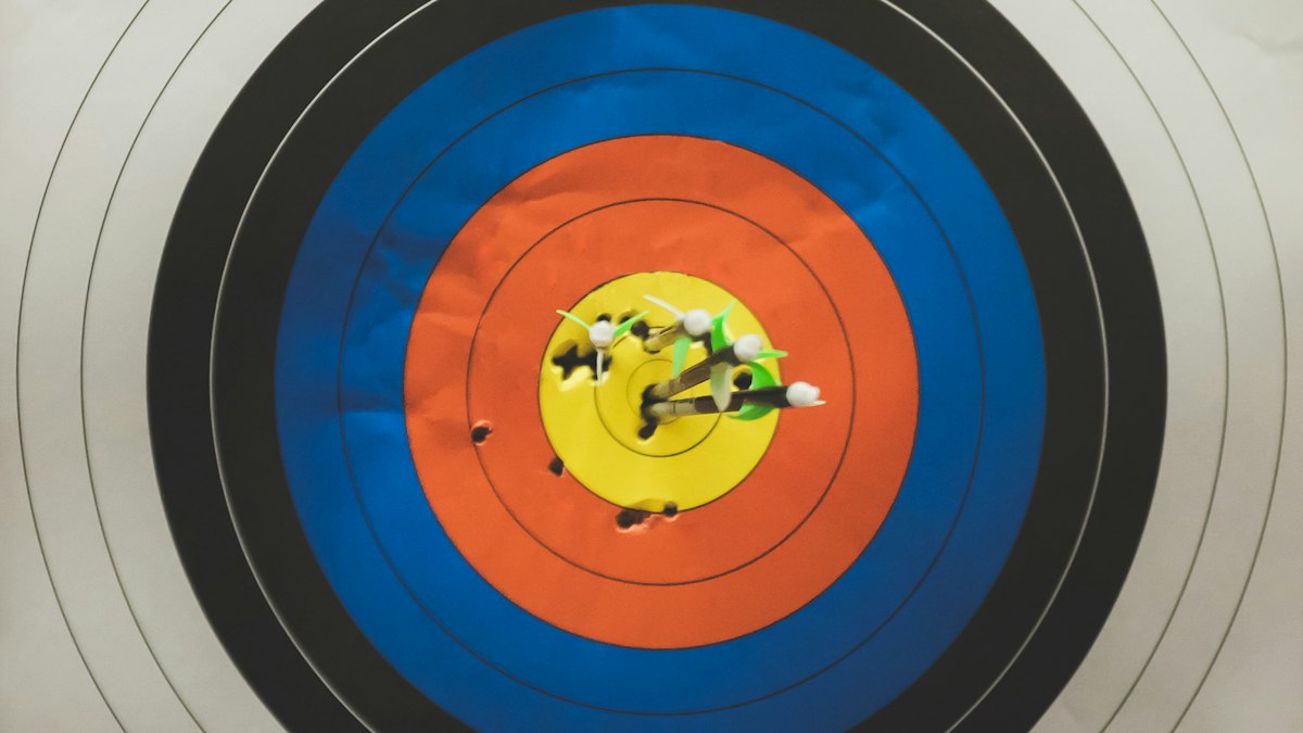 Arrows grouped in an archery target after a high FOC broadhead tuning session