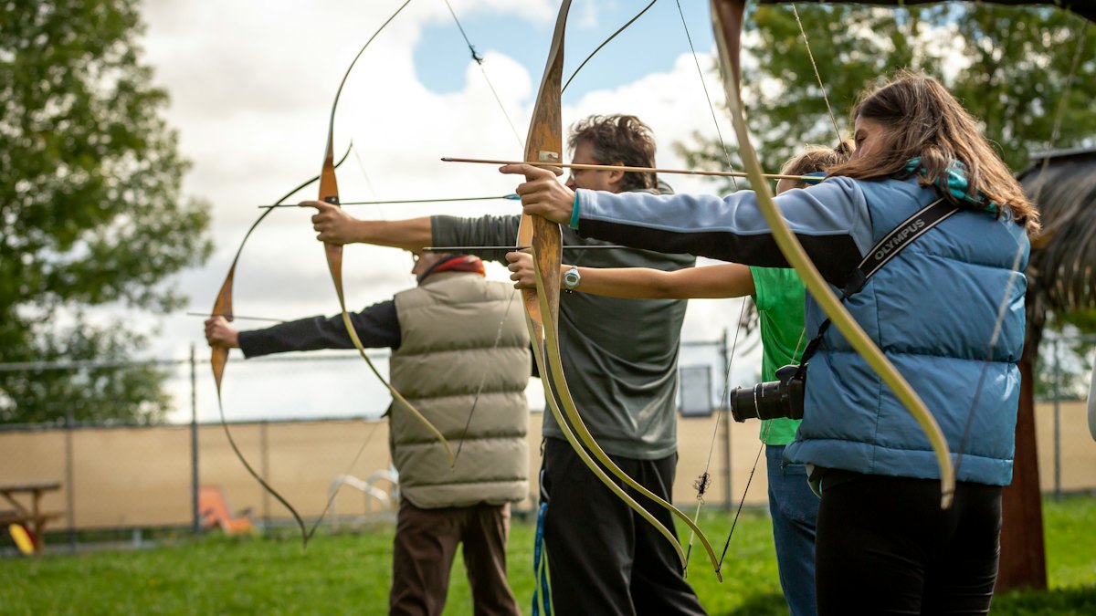Archers practicing with heavy-hunting arrows at a range